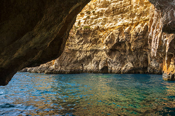 istock Sunlight inside sea cave at Blue Grotto in Malta. 2228294233