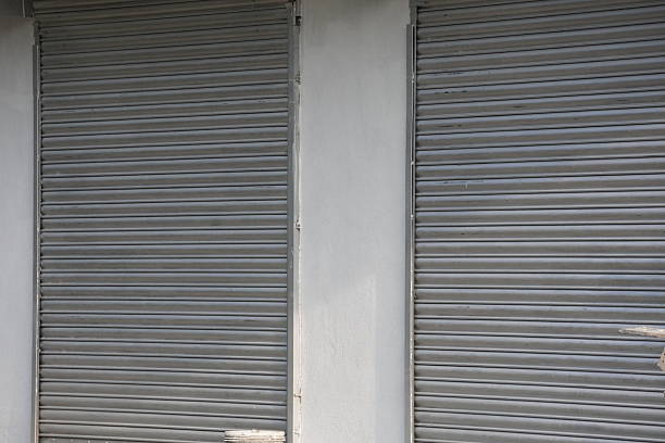 istock A pair of rolling shutters in the front wall of a building 2228295156