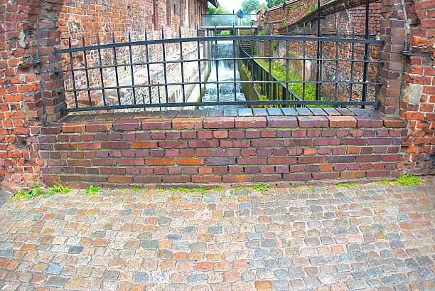 istock Black metal railing and water canal 2228296788