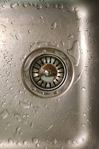 istock Macro Shot of Kitchen Sink Drain With Splash Marks 2228299215
