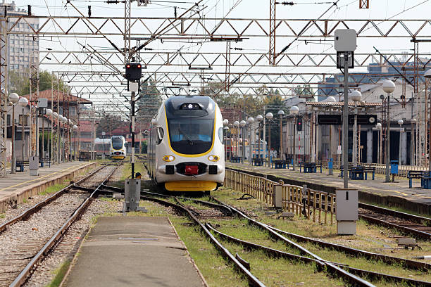 istock Modern electric train arriving at urban railway station 2228300493