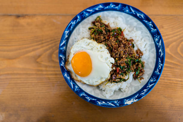Pad Kra Pao is a Thai holy basil stir fry with ground beef topped with a runny fried egg