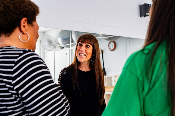 istock Senior woman talking with friends during a break at the dance studio 2228303089