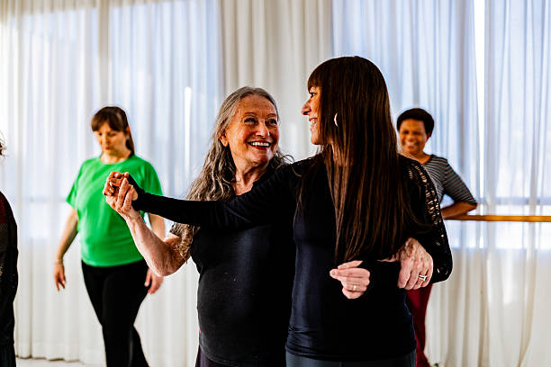 istock Senior dance teacher helping student during dance rehearsal in the studio 2228307286
