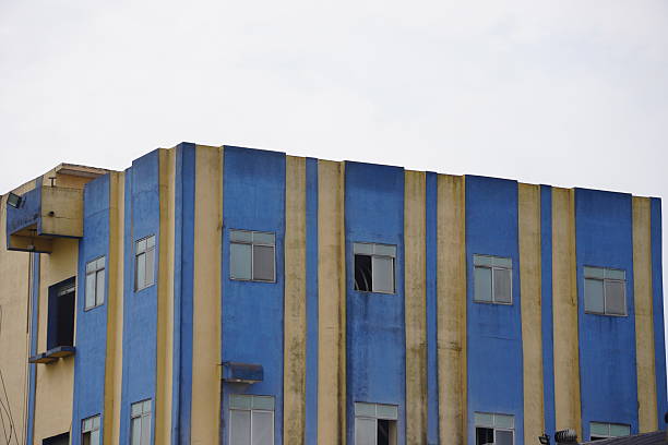 A building with a distinctive blue and yellow striped exterior