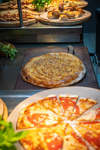 istock Various Turkish traditional minced meat pitas and pizzas standing on the buffet 2228311768