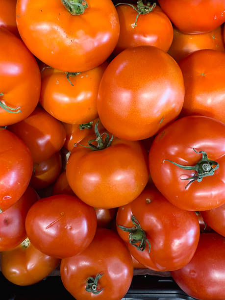 istock Ripe tomatoes stacked in a container, view from above 2228312729