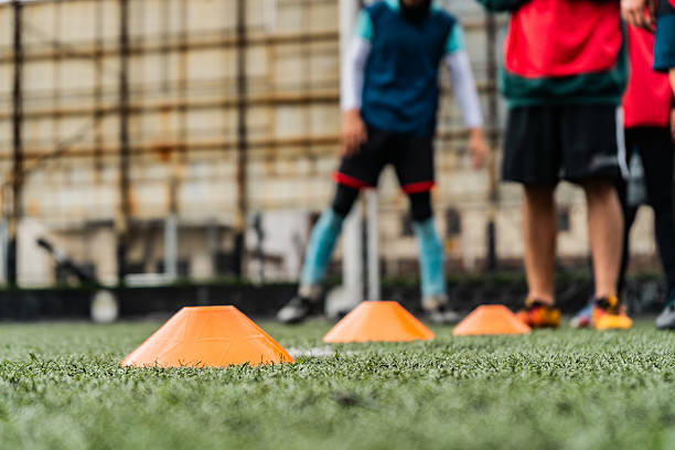 Close-up of training cones on soccer field during practice