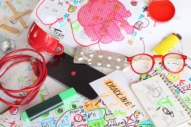 istock Messy workplace,chaotic office, beat the clock,overworked,deadline,stress,bureaucracy concept with grungy desk and various calendar dates and paperwork, stressful business situation. 2228319066