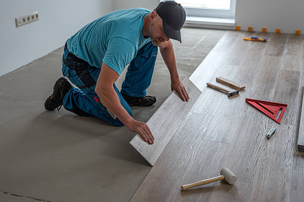 istock Floating floor work. The worker inserts the board of vinyl plank to the click system of Floating floor. 2228319096