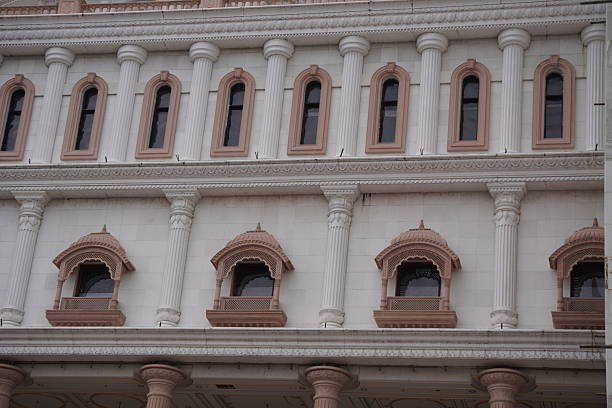 istock Historic European Building Facade with Arched Windows and Ornate Columns 2228320121