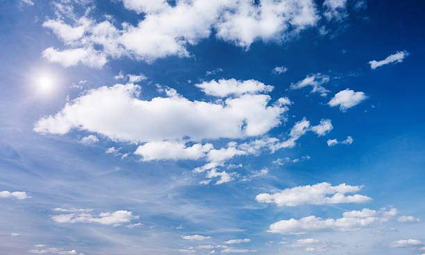 istock Blue sky background with white fluffy clouds in the fresh sunny day. 2228323525