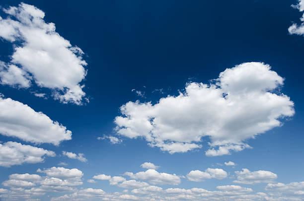 istock Azure sky background with white fluffy clouds in the fresh sunny day. 2228323558