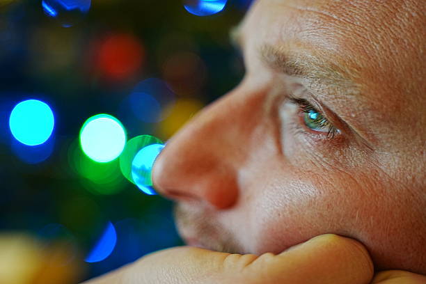 Reflective Gaze Amid Colorful Lights