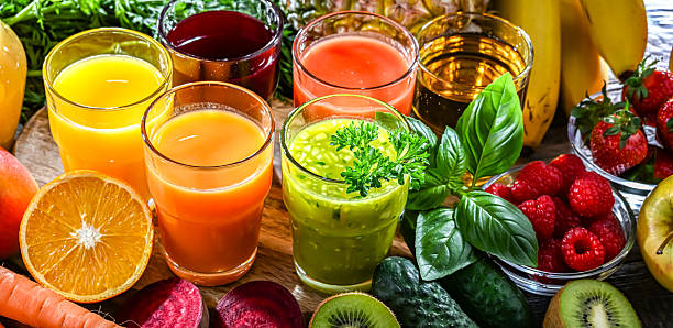 istock Glasses with fresh organic vegetable and fruit juices 2228326563