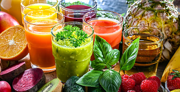 istock Glasses with fresh organic vegetable and fruit juices 2228326761