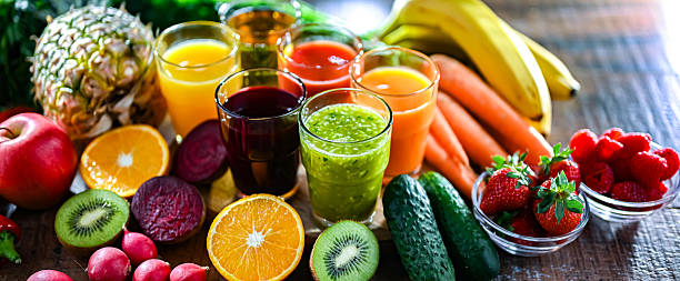 istock Glasses with fresh organic vegetable and fruit juices 2228326776