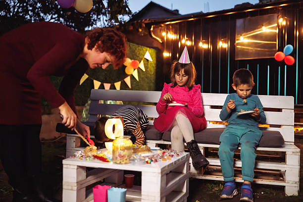 istock Children eating birthday cake at a party 2228326899
