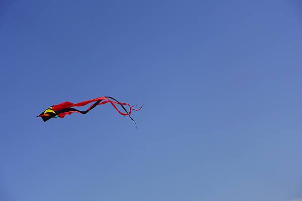 A colorful kite in the blue sky