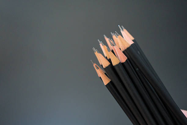 istock A group of black pencil holding on hand 2228329227