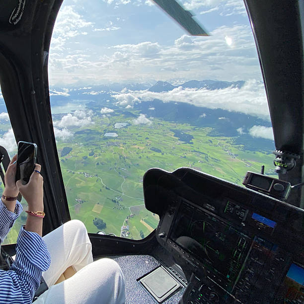 istock Alpine helicopter flies over mountains, cockpit view 2228333479