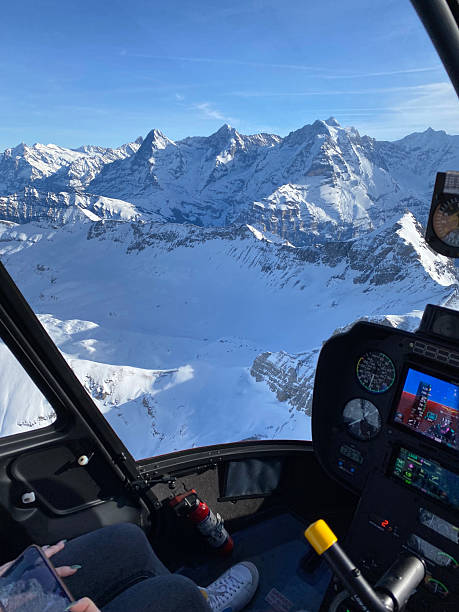 istock Alpine helicopter flies over mountains, cockpit view 2228333580