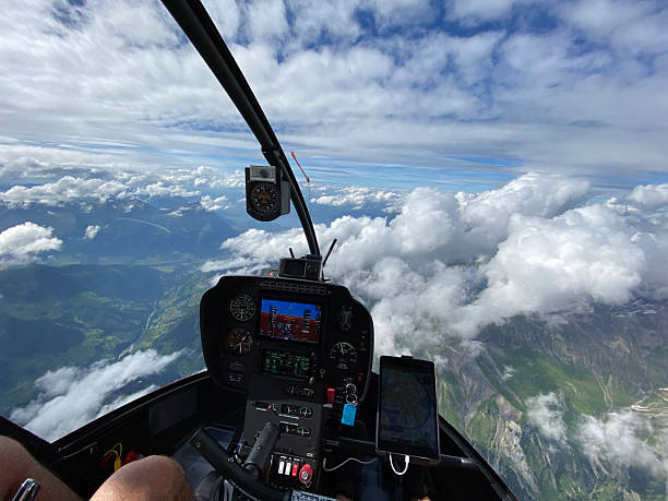 istock Alpine helicopter flies over mountains, cockpit view 2228333645