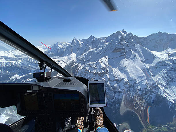 istock Alpine helicopter flies over mountains, cockpit view 2228333667