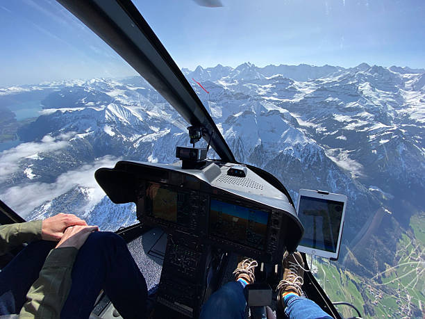 istock Alpine helicopter flies over mountains, cockpit view 2228333668