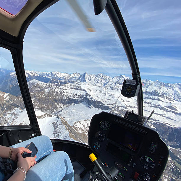 istock Alpine helicopter flies over mountains, cockpit view 2228334183