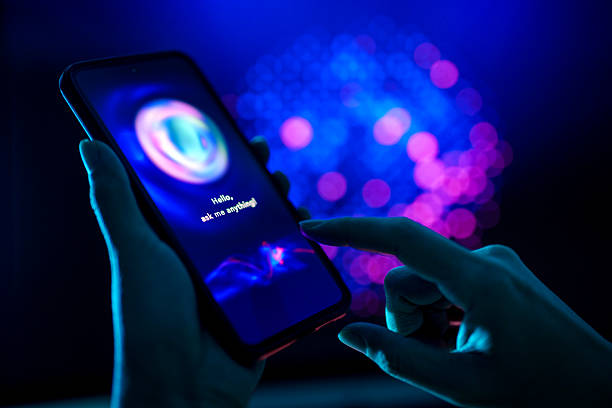 istock Person Using AI Chatbot App on Smartphone in Blue and Purple Light 2228334604