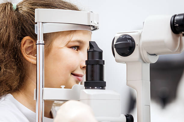 istock Young girl undergoing vision testing with ophthalmic equipment 2228335460