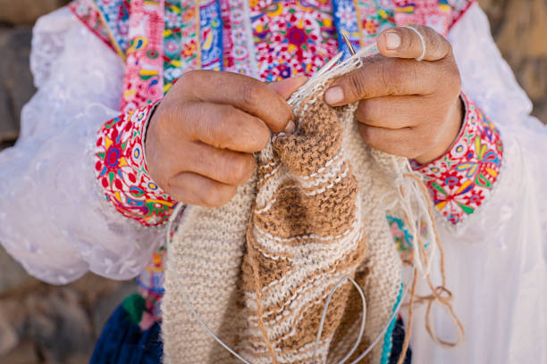 istock Peruvian woman knitting near Colca Canyon, Peru 2228335613
