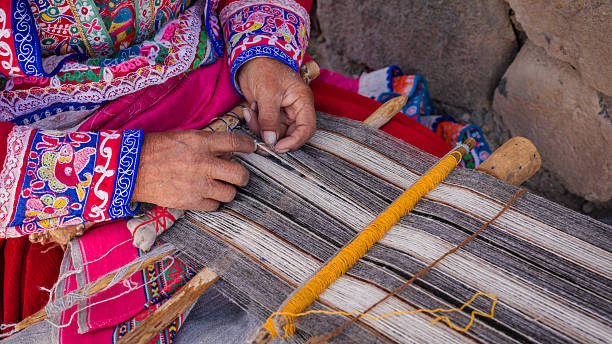 istock Peruvian woman weaving near Colca Canyon, Peru 2228335749