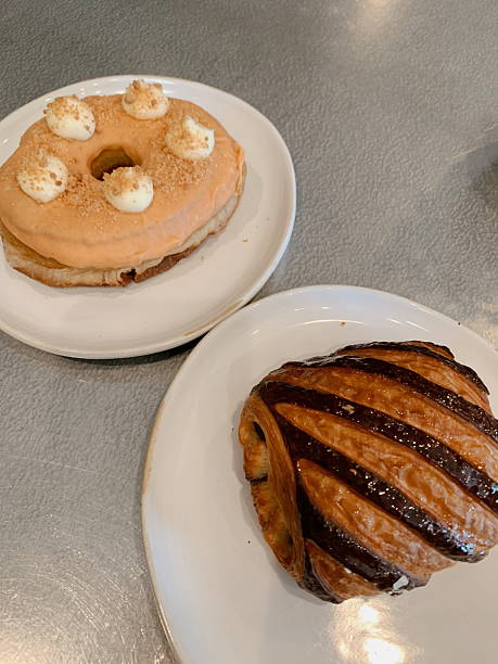 A Striped Raspberry Chocolate Croissant & a Guava Doughnut in a Local Coffee Shop in Sunny West Palm Beach, Florida, in August of 2025
