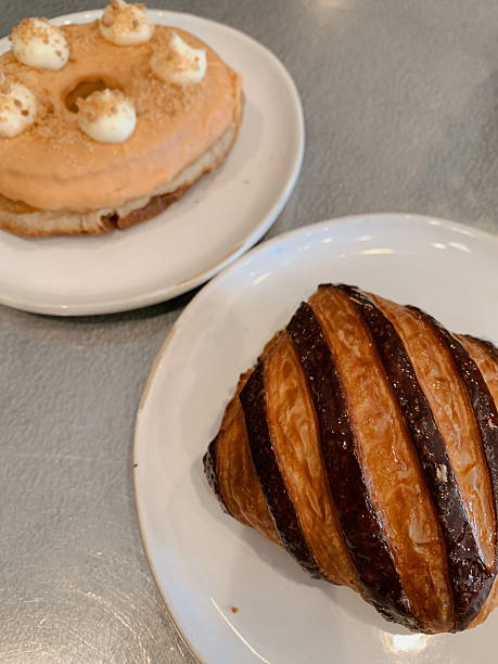 A Striped Raspberry Chocolate Croissant & a Guava Doughnut in a Local Coffee Shop in Sunny West Palm Beach, Florida, in August of 2025