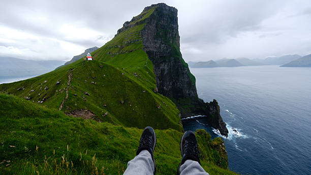 istock Breathtaking view of iconic cliff in Faroe Islands with dramatic ocean backdrop 2228341652