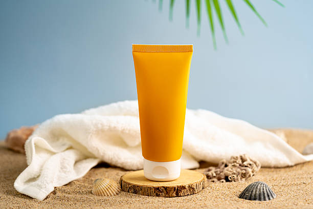 istock Sun care bottles on wood stand 2228341733