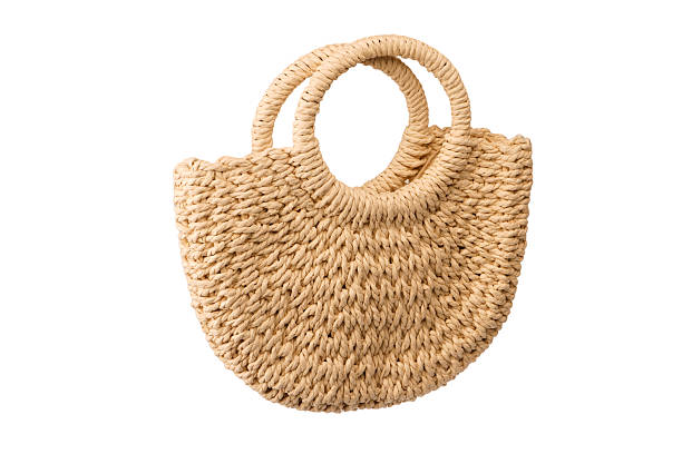 istock A beige straw bag isolated on a white background. 2228342396