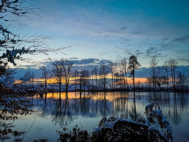 istock sunset winter scenery at lake, switzerland 2228342591