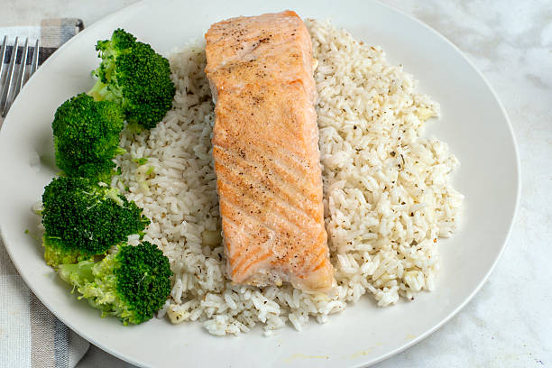 istock seasoned  salmon  with rice and broccoli 2228343277