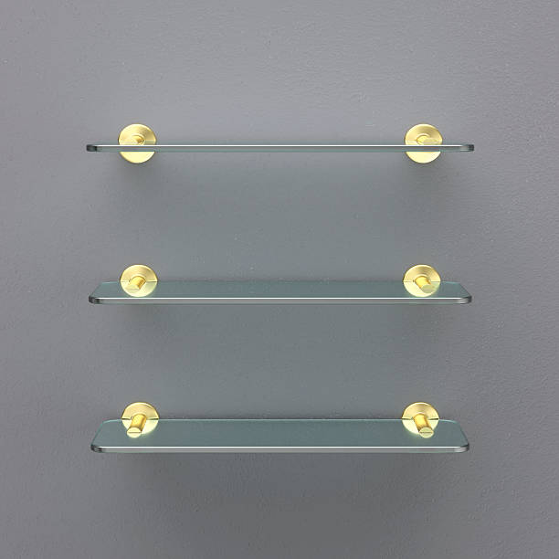 istock Empty glass shelves with golden brackets 2228344798