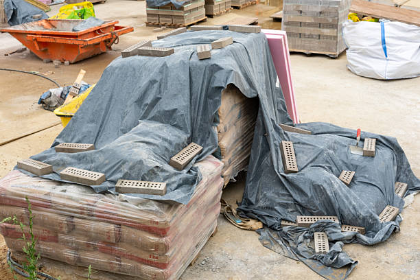 istock Construction materials covering with tarpaulin at building site 2228351760