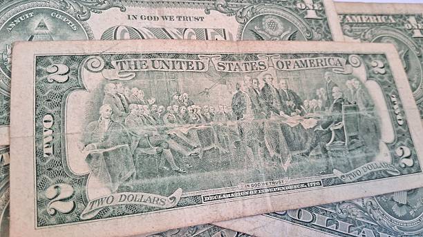 istock Close up of old US dollar bills 2228354109