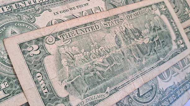 istock Close up of old US dollar bills 2228354203