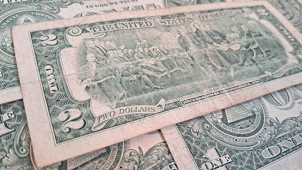 istock Close up of old US dollar bills 2228354204
