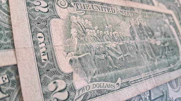 istock Close up of old US dollar bills 2228354208