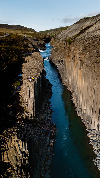 Exploring the stunning basalt columns of Studlagil Canyon in Icelands natural wilderness