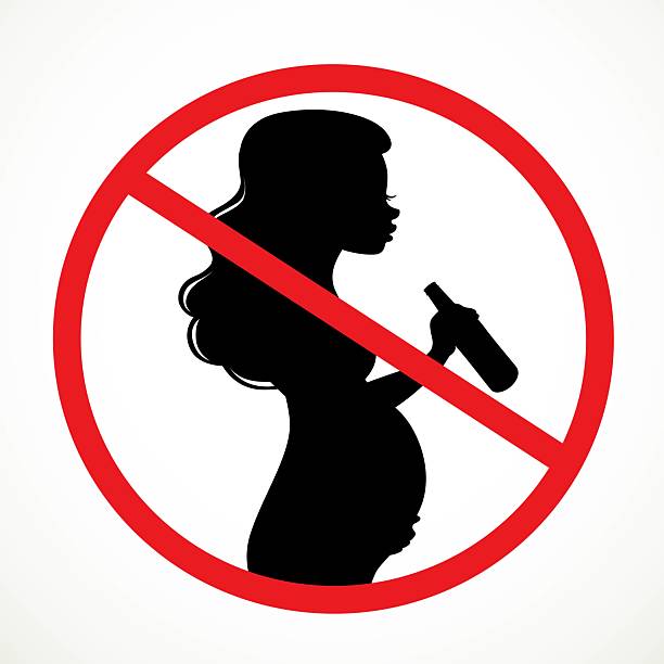 istock Drinking beer  from bottle pregnant woman silhouette prohibiting 2228354930