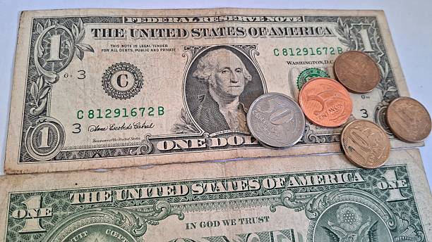 istock US Dollar Bills and Brazilian Coins 2228355905